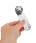 Buttery Smooth 4 Pack Sliding Door Pulley Wheels With Silent Rubber Bottom Rollers and Rock Solid Construction, hand holding a roller.