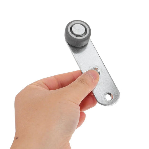 Buttery Smooth 4 Pack Sliding Door Pulley Wheels With Silent Rubber Bottom Rollers and Rock Solid Construction, hand holding a roller.