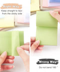 Demonstration of tearing Pastel Sticky Notes 3 By 3 Inch 12 Pack With 50 Sheets Per Pad correctly and incorrectly for easy note use.