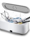 Makes Quick Work Of Hard Grime With This 45 Khz Professional Ultrasonic Jewelry Cleaner featuring glasses and beads in water.