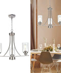 3 Light Brushed Nickel Pendant Chandelier With Clear Glass Shades over dining table in modern setting