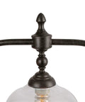 Close-up of Farmhouse Chandelier Hanging Light Fixture in rustic black metal with clear glass shade detail.