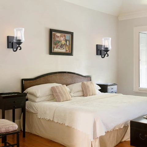 Winsmart Black Wall Sconces Set of Two Hard Wired, positioned beside a bed in a cozy bedroom setting.