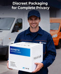 Delivery person holding a box labeled 'MUNBYN' beside vans for discreet packaging service, smiling outdoors.