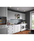 Laundry room with Laundry Utility Faucet With Flexible Spout And Forward Lever In Chrome Finish, dual washer and dryer setup.