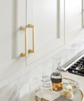 Champagne Bronze Transitional Cabinet Drawer Pull For Cabinets And Furniture With Five And One Sixteenth Inch Center To Center Mounting And Five Seven Eighths Inch Overall Length 1 Pack installed in kitchen