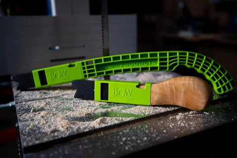 Two green Bow PushPRO PP1 push sticks with EVA-tipped ends on a table saw.