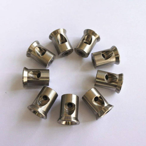 Top view: ten stainless steel waterjet mixing chamber parts, cylindrical components with hole for waterjet cutting machines.