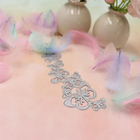 Butterfly String Dies For Card Making And Scrapbooking Dope Hollow Frame Metal Dies on pink background with feathers