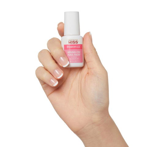 Hand holding Brush On Nail Glue For Press On Nails 5G, Fast Drying, Strong Hold Bond For Repairs, Tips And Wraps