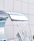 Close-up of chrome waterfall spout from Chrome Bathroom Sink Faucet With 3 Holes And 2 Handles Crystal Knobs High Arc Waterfall Spout Vanity Basin Mixer Tap 8 Inch Upwards Widespread Bathtub Filler Faucet Solid Brass No Drip Ceramic Disc Cartridge.
