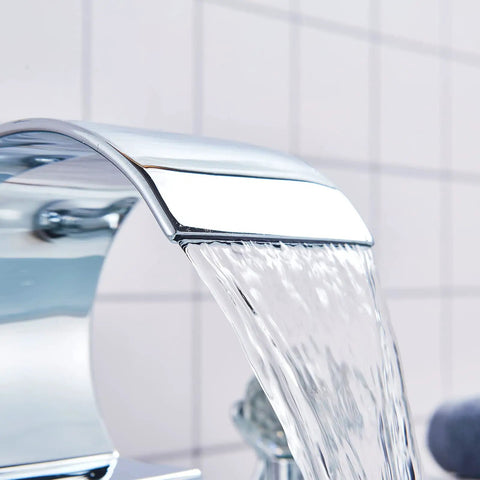 Close-up of chrome waterfall spout from Chrome Bathroom Sink Faucet With 3 Holes And 2 Handles Crystal Knobs High Arc Waterfall Spout Vanity Basin Mixer Tap 8 Inch Upwards Widespread Bathtub Filler Faucet Solid Brass No Drip Ceramic Disc Cartridge.