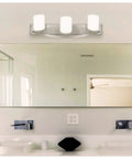 Modern Three Light Bathroom Vanity Light Fixture In Brushed Nickel With Glass Globes Reversible Mounting Up Or Down For Bathrooms