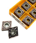 Premium Indexable Carbide Lathe Tool CNMG120408MA 15TF showing two inserts in a tray for CNC metal cutting.