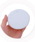 Eight Piece Heavy Duty Iron Fire Sprinkler Cover Plate With Slick Drop In Ready Design For Seamless Ceiling Installation And Clean Home Safety Shield Guard Setup held in hand.