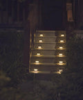 Solar Step Lights For Decks Pathways Stairs And Yard Fences LED Outdoor Waterproof Warm White Glow No Fuss Install Low Profile Ambient Lighting All Weather 12 Pack illuminating outdoor stairs.