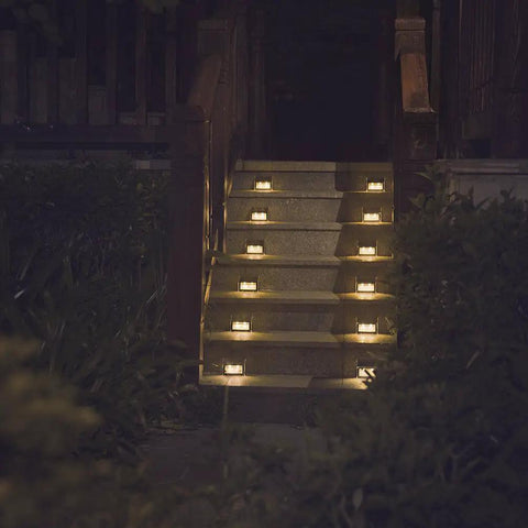 Solar Step Lights For Decks Pathways Stairs And Yard Fences LED Outdoor Waterproof Warm White Glow No Fuss Install Low Profile Ambient Lighting All Weather 12 Pack illuminating outdoor stairs.