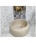 Travertine Marble Hammam Basin 16.5 x 9.8 inches Modern Oval Design for Bathroom Spa and Turkish Bath Use Stone Sink Durable and refined Beige Color against patterned backdrop.