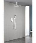 16" Rain Systems Wall Mounted Shower in white with ceiling mount and hand shower installed on a gray wall.