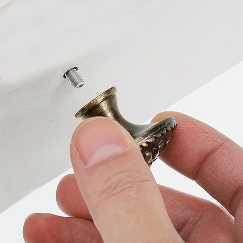Pretty Dang Slick Antique Zinc Alloy Cabinet Drawer Pulls And Round Vanity Knobs For Kitchen Bathroom Bedroom Furniture Makeover Projects With High Quality Modern Classic Look, showing a hand holding a bronze round knob.