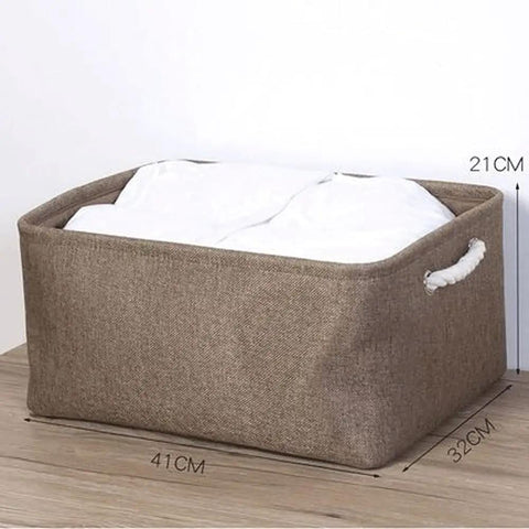 Hella Spacious Collapsible Storage Bins, Slick Foldable Canvas Fabric Cubes With Handles, Solid 3 Pack in natural color on wooden surface.