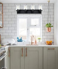 4 Light Vanity Fixture With Crystal Clear Glass Shades In Matte Black Industrial Style For Over Mirror In Bathrooms And Powder Rooms installed in a kitchen