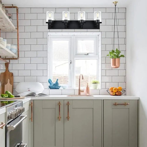 4 Light Vanity Fixture With Crystal Clear Glass Shades In Matte Black Industrial Style For Over Mirror In Bathrooms And Powder Rooms installed in a kitchen