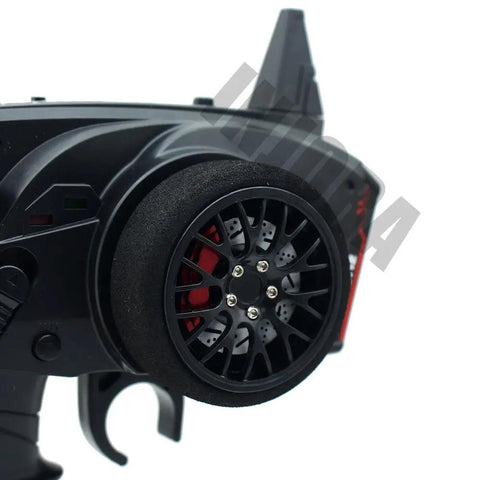 Close-up of 3 Channel 2.4G Anti-Jamming RC Transmitter With Receiver for RC Cars and Boats, steering wheel feature.