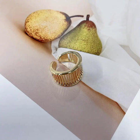 Fresh Vintage Wide Cuff Open Ring For Women Featuring A Bold Hollow Geometric Grid And Striped Texture, showing a gold cuff on soft background.