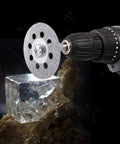Diamond cutting wheel (22mm) mounted on a rotary tool, cutting a crystal block