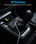 iPhone charging with USB A To Lightning CarPlay Cable in car console, 3ft length, for fast charging and syncing on road trip.