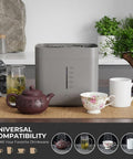 Automatic Desktop Cup Washer With 1.8L Tank Electric Glass Rinser fits diverse drinkware and teapots on countertop.