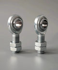 Built Tight For Your Daily Driver Rig Drop Right In Heim Joint Rod End Kit Three Quarter Sixteen CmR12 Male Spherical Bearing Locking Nut Link Rod Suspension Arm 45 Carbon Steel 52100 Zero Play Control Eighteen Thousand Pounds 2 Piece Set: close-up of two male Heim rod ends with locking nuts in a silver finish.