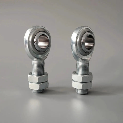 Built Tight For Your Daily Driver Rig Drop Right In Heim Joint Rod End Kit Three Quarter Sixteen CmR12 Male Spherical Bearing Locking Nut Link Rod Suspension Arm 45 Carbon Steel 52100 Zero Play Control Eighteen Thousand Pounds 2 Piece Set: close-up of two male Heim rod ends with locking nuts in a silver finish.