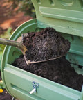 Shovel filling green Back Porch Compost Tumbler For Small Yards And Urban Spaces With Odor Control And Fully Enclosed Design