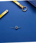 Top Shelf 20 Pack Metal Torsion Springs For Garbage Can Lids, Silent Operation Replacement Kit With Five Coils Perfect For Family Home Or Office Trash Cans That Work Like A Champ. silver five-coil torsion spring on blue background