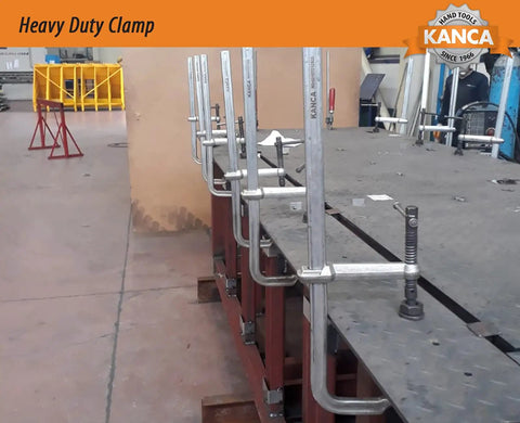 Beefy Heavy Duty Bar Clamp With A 24 Inch Opening And 12000 N Clamping Force In Drop Forged F Clamp Design on metal frame