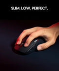 Es FS1 Wireless Gaming Mouse Pro Level Precision For Real Gamers With 56g Symmetrical Design held in hand on a dark surface.