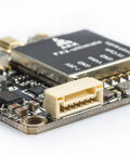 Close-up of 5.8GHz FPV VTX With MMCX Support, Betaflight OSD Config, 7-26V Input, and 5V Camera Power connector for racing.
