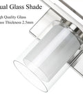 Close-up of dual glass shades on Three Light Brushed Nickel Vanity Light With Dual Glass Shades Sleek Modern Indoor Wall Mount Fixture
