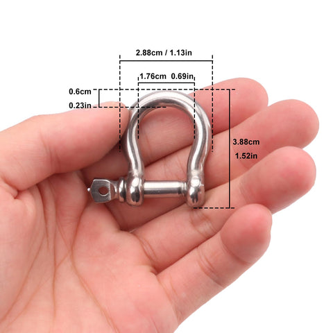 Close-up of hand holding Beefy One Quarter Inch D Ring Shackles In Grade 304 Stainless Steel With Screw Pin, showing measurements