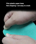 A close-up of hands holding a teal film plastic paper sanding disc showing its flexibility, part of Get The Ultimate 100pc Wet And Dry Sanding Discs Perfect For Random Orbital Sanders With Super Durable Hook And Loop Backing In Grits Ranging From 60 To 2000 For Total Makeover Jobs.