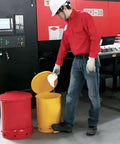 Person using Heavy Duty Galvanized Steel Oily Waste Can Built Tough As Nails For Shop Use With Hands Free Kick Lever And Rust Proof Finish For Fire Safe Rag Pickup In Garages.
