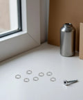 Heavy Duty 300 Piece M6 Stainless Steel Spring Lock Washers Anti Loosening Hardware Fasteners For Bolts And Nuts on a tabletop.