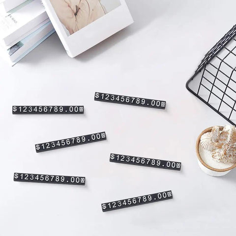 Price Display Cube Tags Set 50 With Adjustable Stand for jewelry shop, showing black plastic dollar block cubes on white background.