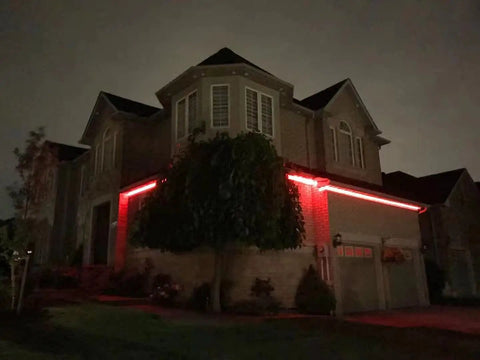 Two-story house illuminated by red WiFi LED Light Strip Kit 65.6ft Waterproof IP65 All In One Set With 5050 LEDs, UL Certified