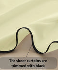 Light Yellow Semi Sheer Curtains Two Panels 84 Inches Long 52 Inch Wide Light Filtering Window Drapes close-up of black trim