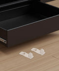 Close-up of clear plastic 24 Pack Locking Shelf Brackets with Antislip Grooves for 20mm cabinets near a drawer on wooden floor.