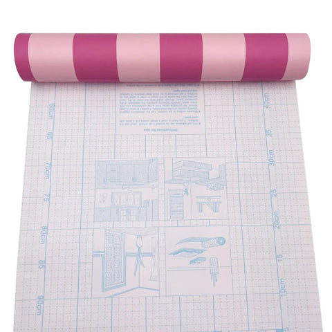 Rose Pink Stripe Peel And Stick Wallpaper Self Adhesive Vinyl Removable Wall Covering For Cabinets Drawers DIY Room Flip With A Rad Chic Vibe Easy Apply Covers Forty Eight Total Sq Ft rolled out showing bold pink and magenta stripes.