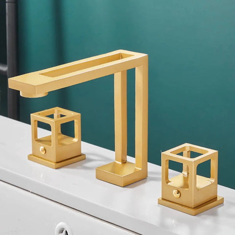 Slick Brushed Gold Widespread Bathroom Faucet 8 Inch Centers 3 Holes Dual Handle Vanity Sink Mixer Aerator Spout For Splash Free Flow Lead Free Solid Brass Construction Durable Water Supply Hose Included, showcasing square design on white vanity sink.